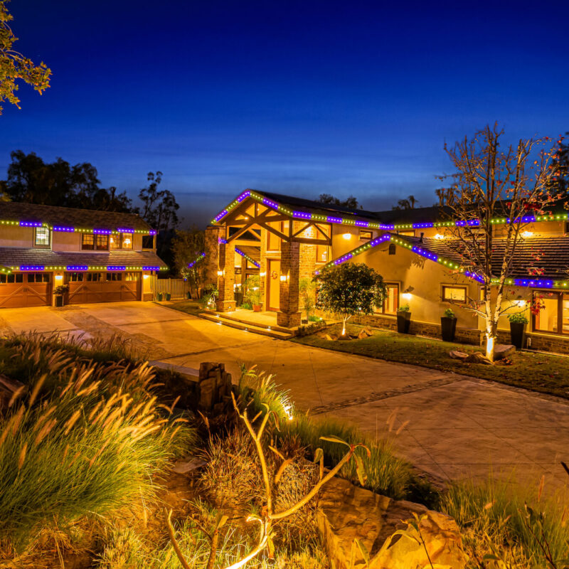 permanent Christmas lights on roof of home and garage